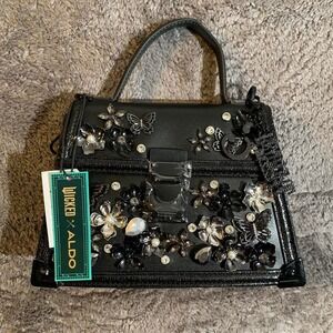 Rare Wicked x Aldo black purse with rhinestone flowers and Charms